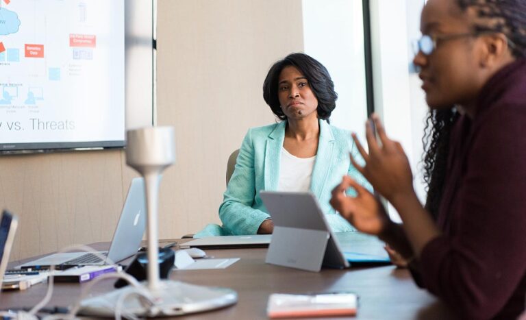 Woman listening during business meeting