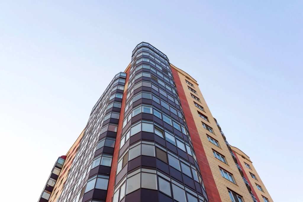 Low-angle view of glass-and-brick high-rise building